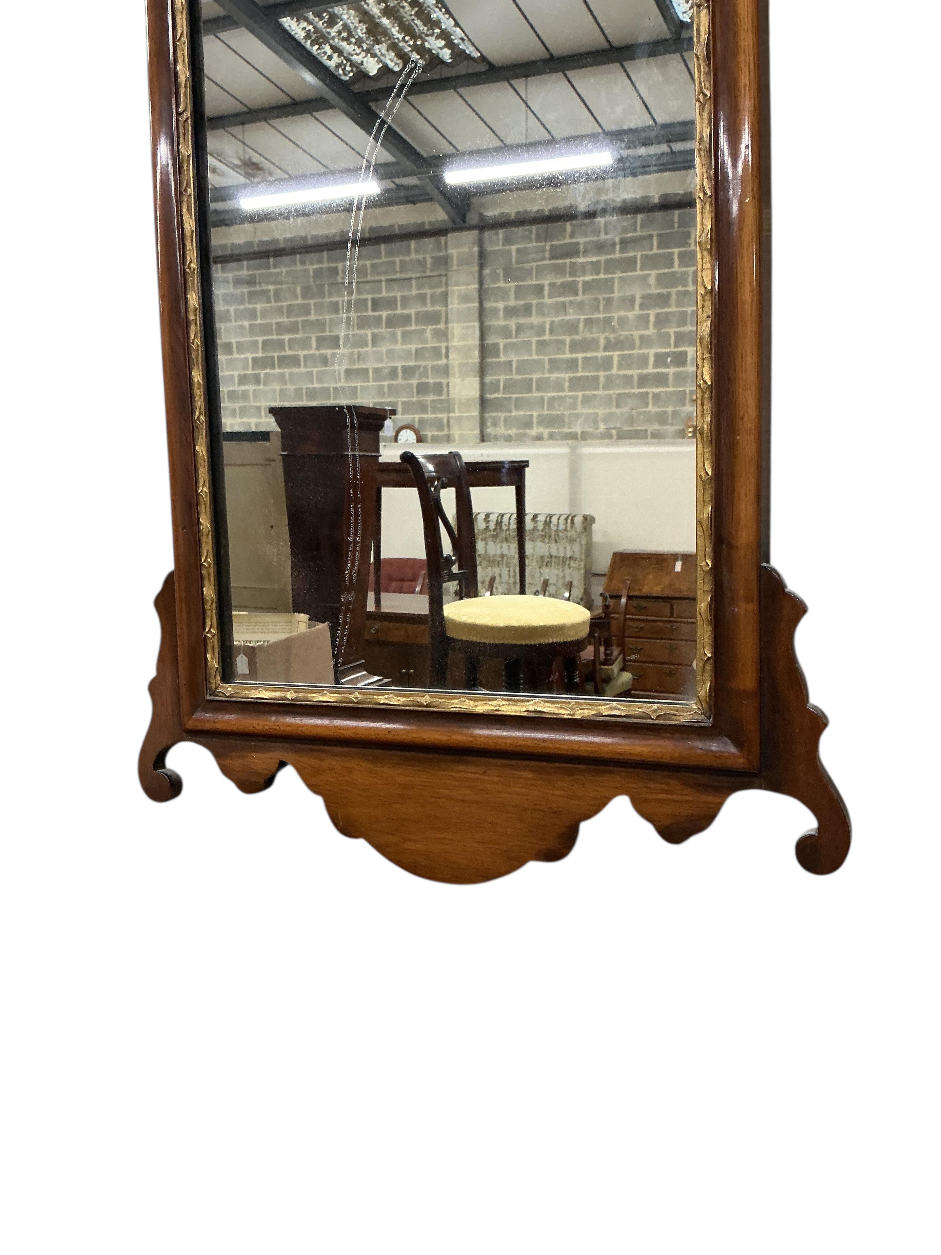 A George III style mahogany fret cut wall mirror, width 38cm, height 68cm